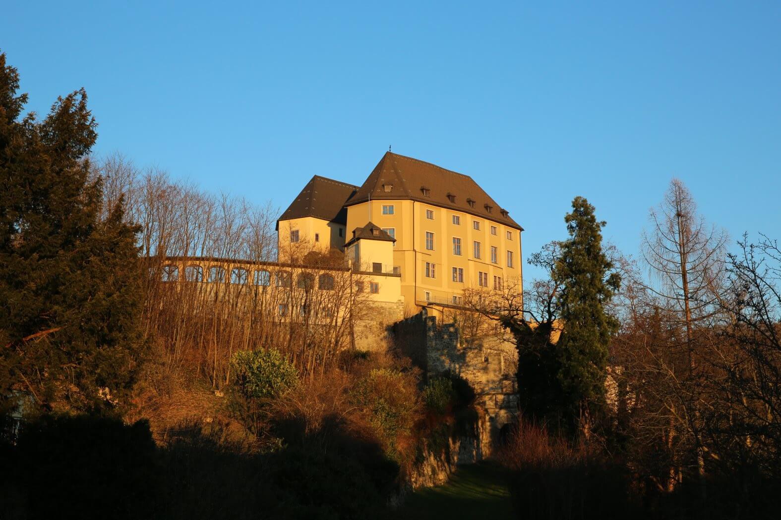castle steyregg upper austria from below sunset
