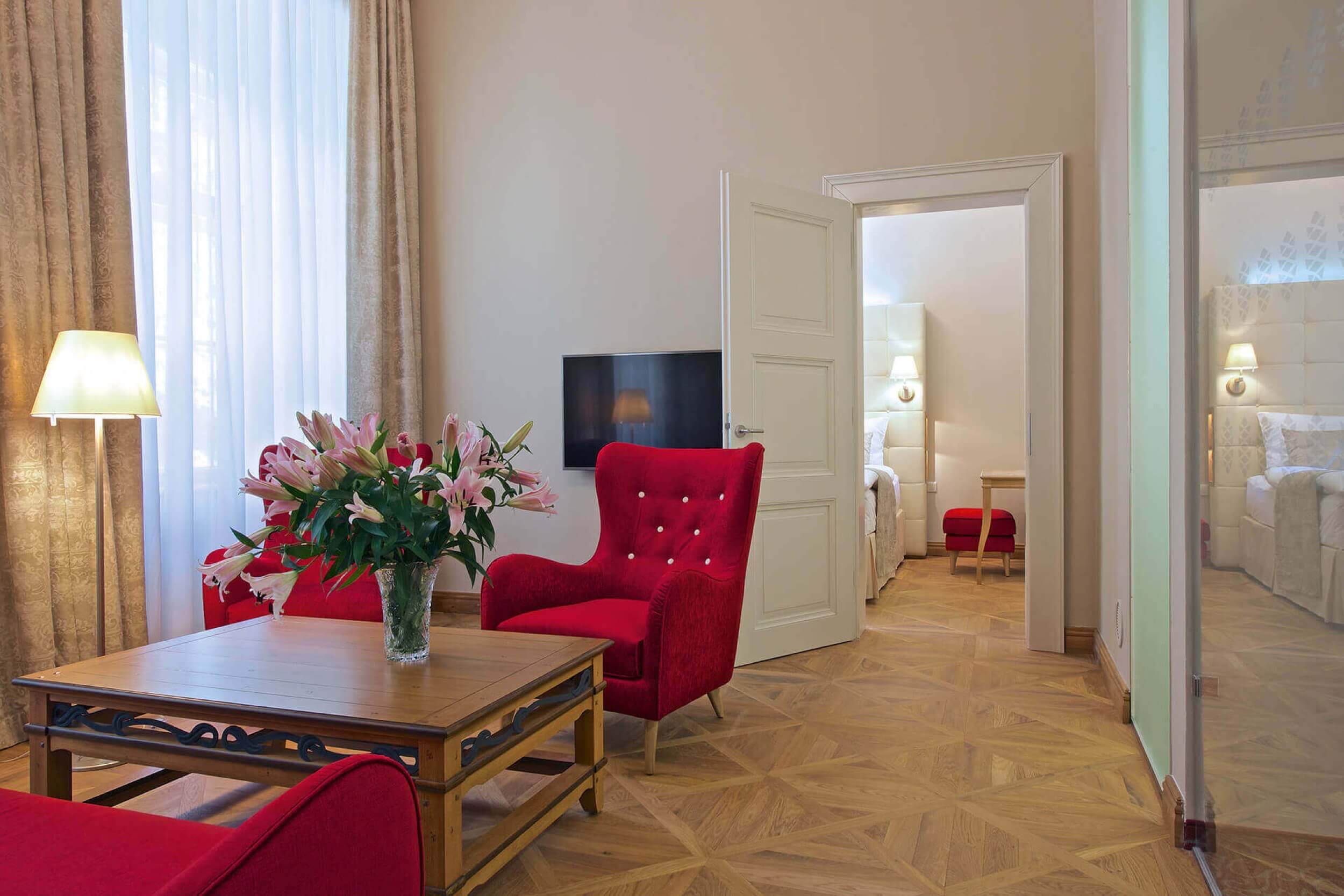 ratmerice castle room with red chairs white door